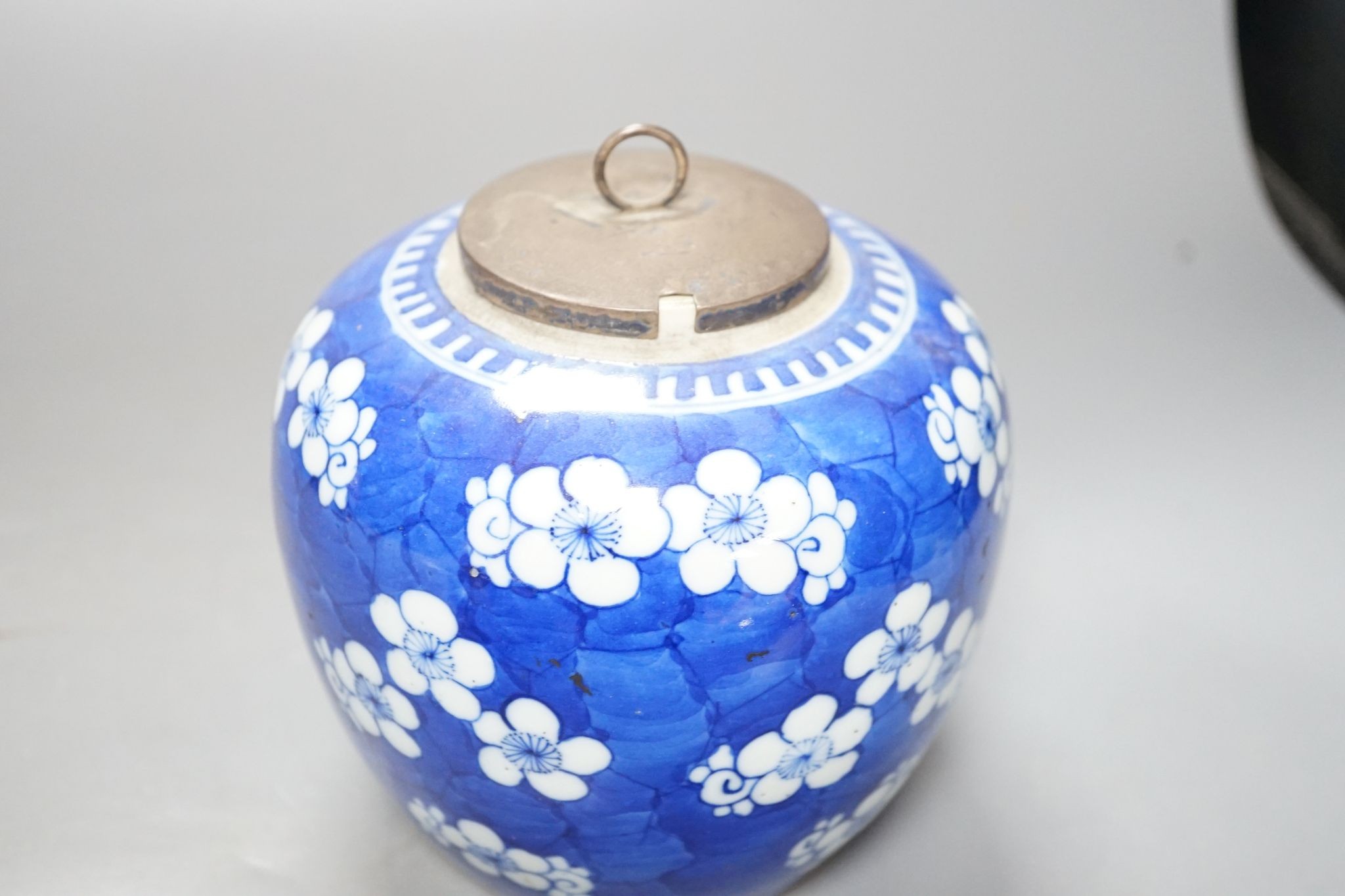 Three Chinese blue and white prunus decorated jars and covers, 19th/20th century, with four character marks 18cm